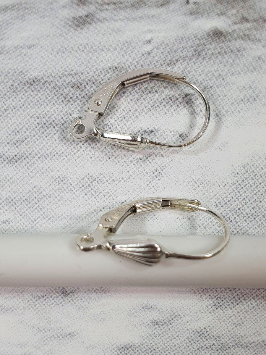 2 זוגות עגילי D מעוטרים בדוגמת צדף Silver 925 - דוארט | DoArt